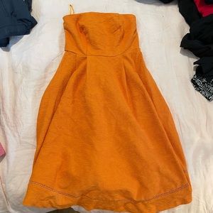 Orange strapless New York and company Eva Mendes dress